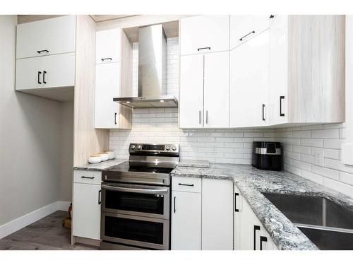 162 Kinniburgh Crescent, Chestermere, AB - Indoor Photo Showing Kitchen With Double Sink