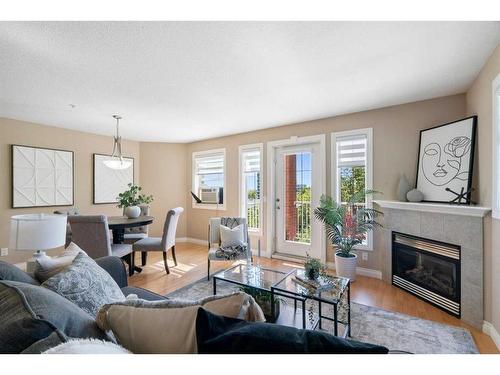 405-417 3 Avenue Ne, Calgary, AB - Indoor Photo Showing Living Room With Fireplace