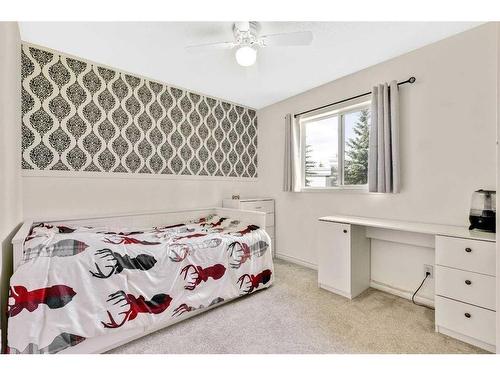 228 Willowbrook Close Nw, Airdrie, AB - Indoor Photo Showing Bedroom