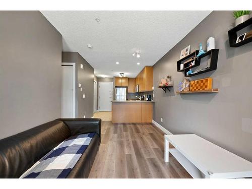 # 202-35 Richard Court Sw, Calgary, AB - Indoor Photo Showing Other Room