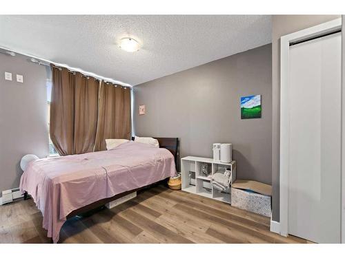 # 202-35 Richard Court Sw, Calgary, AB - Indoor Photo Showing Bedroom