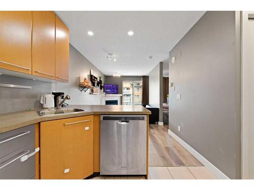 # 202-35 Richard Court Sw, Calgary, AB - Indoor Photo Showing Kitchen