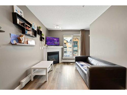 # 202-35 Richard Court Sw, Calgary, AB - Indoor With Fireplace