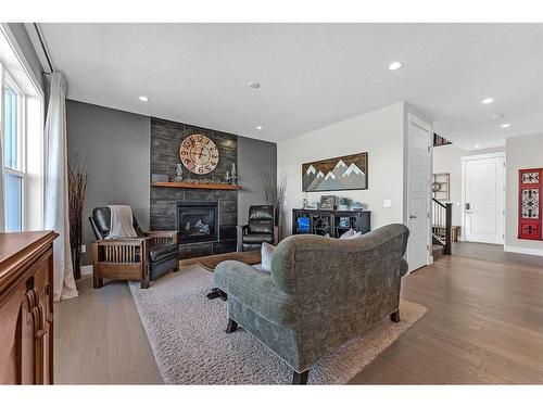 1461 Aldrich Place, Carstairs, AB - Indoor Photo Showing Living Room With Fireplace