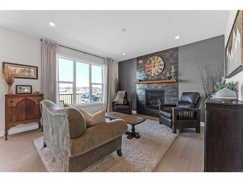 1461 Aldrich Place, Carstairs, AB - Indoor Photo Showing Living Room With Fireplace