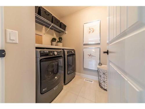 32 Cranbrook Green Se, Calgary, AB - Indoor Photo Showing Laundry Room