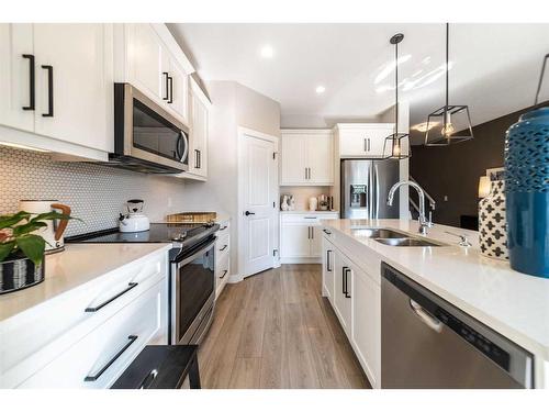 32 Cranbrook Green Se, Calgary, AB - Indoor Photo Showing Kitchen With Double Sink With Upgraded Kitchen