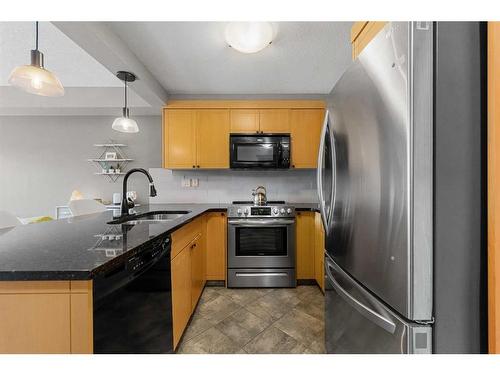 205-315 50 Avenue Sw, Calgary, AB - Indoor Photo Showing Kitchen With Stainless Steel Kitchen