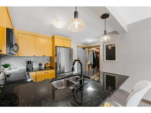 205-315 50 Avenue Sw, Calgary, AB - Indoor Photo Showing Kitchen With Double Sink