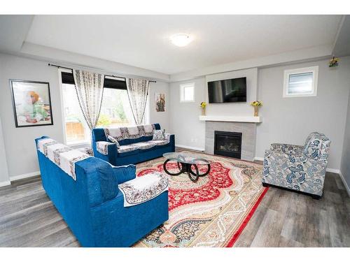 52 Yorkstone Grove Sw, Calgary, AB - Indoor Photo Showing Living Room With Fireplace