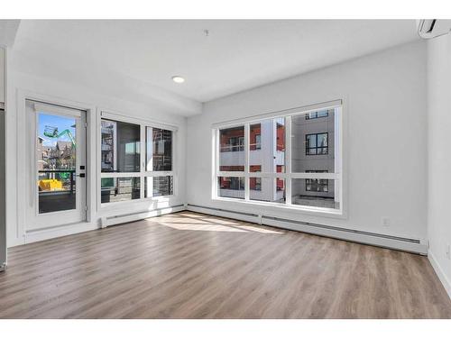 2215-350 Livingston Common Ne, Calgary, AB - Indoor Photo Showing Living Room