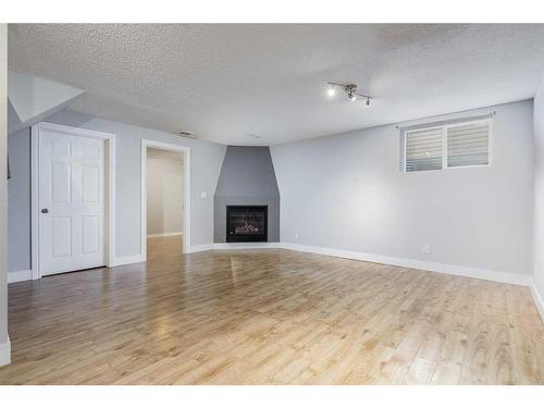 22 Bridleridge Road Sw, Calgary, AB - Indoor With Fireplace