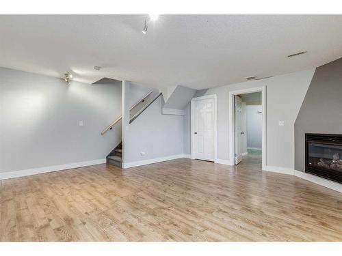 22 Bridleridge Road Sw, Calgary, AB - Indoor With Fireplace