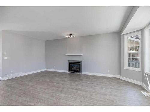 22 Bridleridge Road Sw, Calgary, AB - Indoor With Fireplace