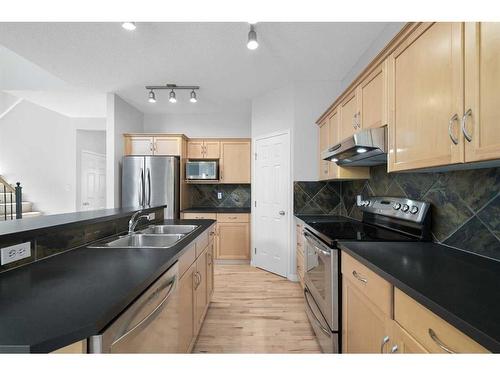 110 Valley Crest Close Nw, Calgary, AB - Indoor Photo Showing Kitchen With Double Sink