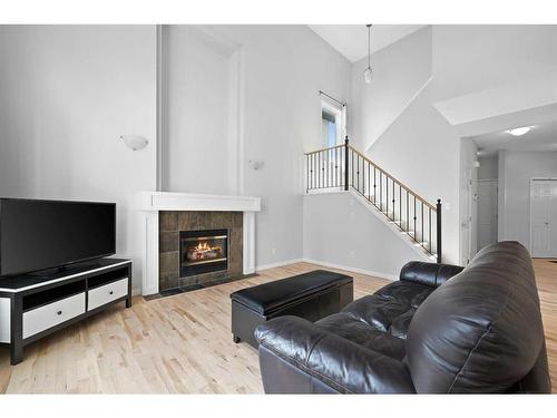 110 Valley Crest Close Nw, Calgary, AB - Indoor Photo Showing Living Room With Fireplace