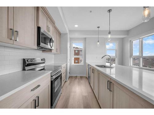 412-80 Carrington Plaza Nw, Calgary, AB - Indoor Photo Showing Kitchen With Double Sink With Upgraded Kitchen