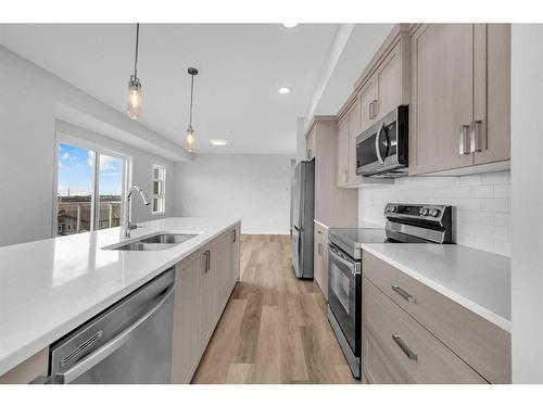 412-80 Carrington Plaza Nw, Calgary, AB - Indoor Photo Showing Kitchen With Stainless Steel Kitchen With Double Sink With Upgraded Kitchen