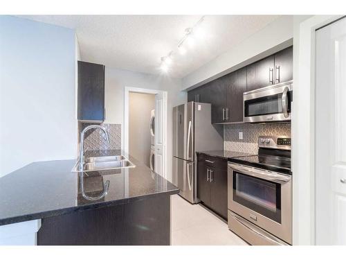 3115-81 Legacy Boulevard Se, Calgary, AB - Indoor Photo Showing Kitchen With Double Sink