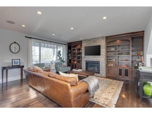 82 Aspen Cliff Close Sw, Calgary, AB - Indoor Photo Showing Living Room With Fireplace