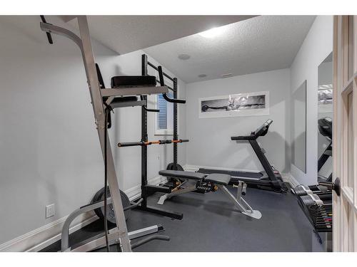 82 Aspen Cliff Close Sw, Calgary, AB - Indoor Photo Showing Gym Room