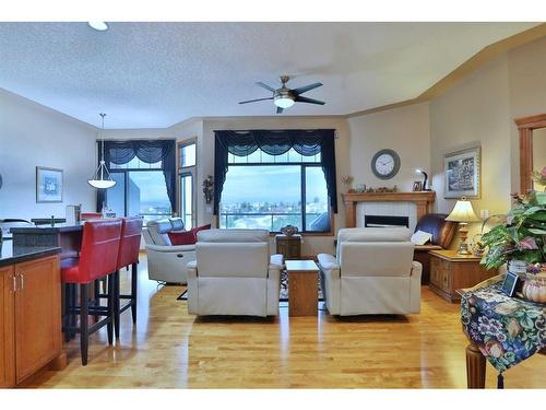 12 Arbour Crest Mount Nw, Calgary, AB - Indoor Photo Showing Living Room With Fireplace