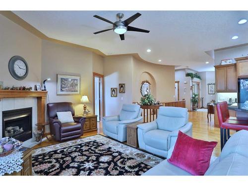 12 Arbour Crest Mount Nw, Calgary, AB - Indoor Photo Showing Living Room With Fireplace