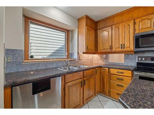 92 Deermeade Road Se, Calgary, AB - Indoor Photo Showing Kitchen With Double Sink