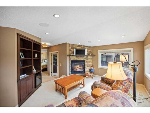 708 Willingdon Boulevard Se, Calgary, AB - Indoor Photo Showing Living Room With Fireplace