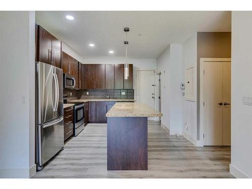 4-2101 17 Street Sw, Calgary, AB - Indoor Photo Showing Kitchen With Stainless Steel Kitchen