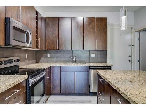 4-2101 17 Street Sw, Calgary, AB - Indoor Photo Showing Kitchen With Stainless Steel Kitchen