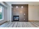 4-2101 17 Street Sw, Calgary, AB  - Indoor Photo Showing Living Room With Fireplace 