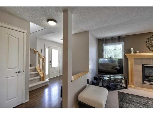 199 Chapman Circle Se, Calgary, AB - Indoor Photo Showing Other Room With Fireplace