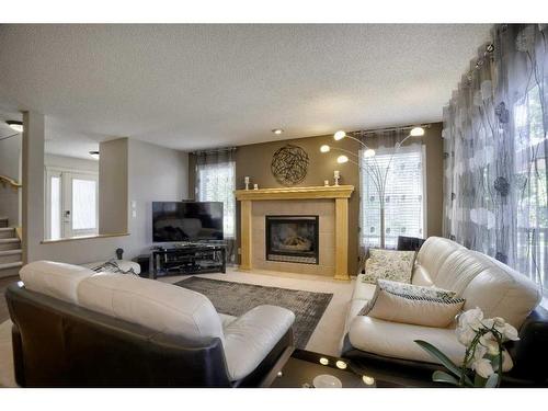 199 Chapman Circle Se, Calgary, AB - Indoor Photo Showing Living Room With Fireplace