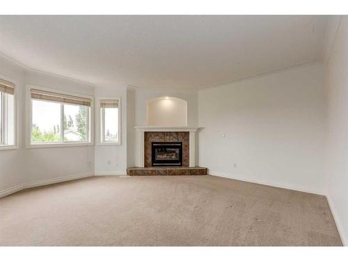 117 Evergreen Way Sw, Calgary, AB - Indoor Photo Showing Living Room With Fireplace