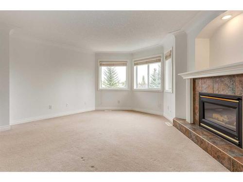 117 Evergreen Way Sw, Calgary, AB - Indoor With Fireplace