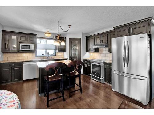 228 Sheep River Lane, Okotoks, AB - Indoor Photo Showing Kitchen With Upgraded Kitchen