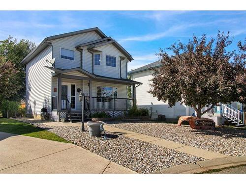 228 Sheep River Lane, Okotoks, AB - Outdoor With Deck Patio Veranda With Facade