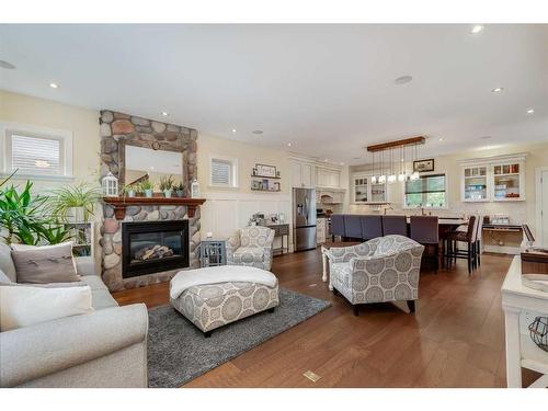 473 Sunset Link, Crossfield, AB - Indoor Photo Showing Living Room With Fireplace