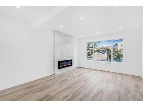 11113 Hidden Valley Drive, Calgary, AB - Indoor Photo Showing Living Room With Fireplace