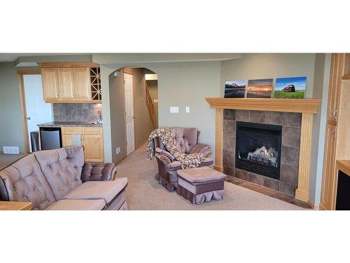 72 Shannon Gardens Sw, Calgary, AB - Indoor Photo Showing Living Room With Fireplace