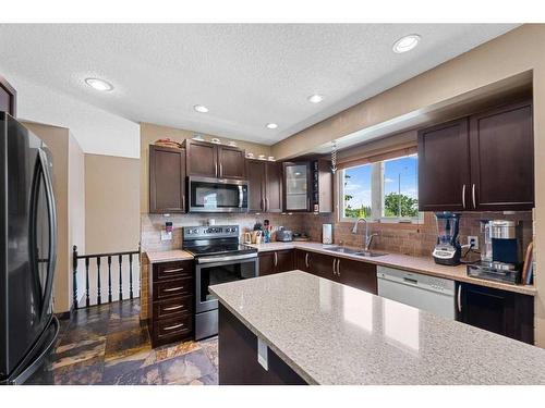 4624 Namaka Crescent Nw, Calgary, AB - Indoor Photo Showing Kitchen With Double Sink