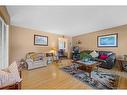 4624 Namaka Crescent Nw, Calgary, AB  - Indoor Photo Showing Living Room 