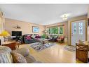 4624 Namaka Crescent Nw, Calgary, AB  - Indoor Photo Showing Living Room 