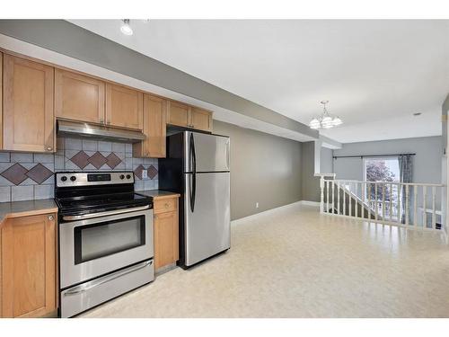 213 Bridlewood Lane Sw, Calgary, AB - Indoor Photo Showing Kitchen With Stainless Steel Kitchen