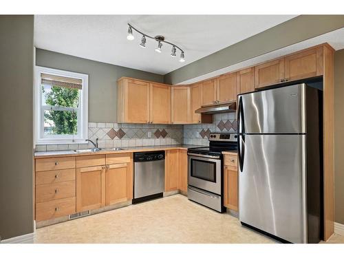 213 Bridlewood Lane Sw, Calgary, AB - Indoor Photo Showing Kitchen With Stainless Steel Kitchen