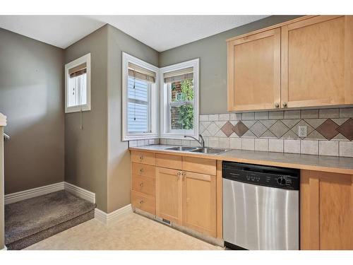 213 Bridlewood Lane Sw, Calgary, AB - Indoor Photo Showing Kitchen With Double Sink