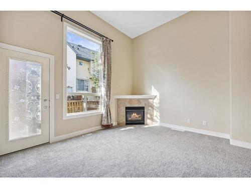 213 Bridlewood Lane Sw, Calgary, AB - Indoor With Fireplace