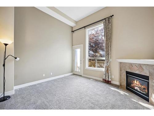 213 Bridlewood Lane Sw, Calgary, AB - Indoor With Fireplace