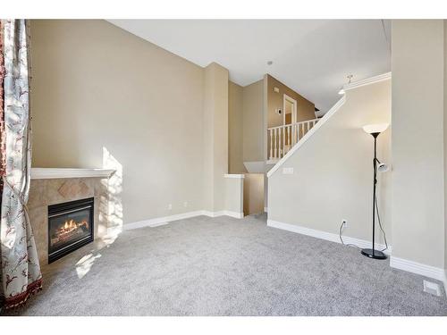 213 Bridlewood Lane Sw, Calgary, AB - Indoor With Fireplace